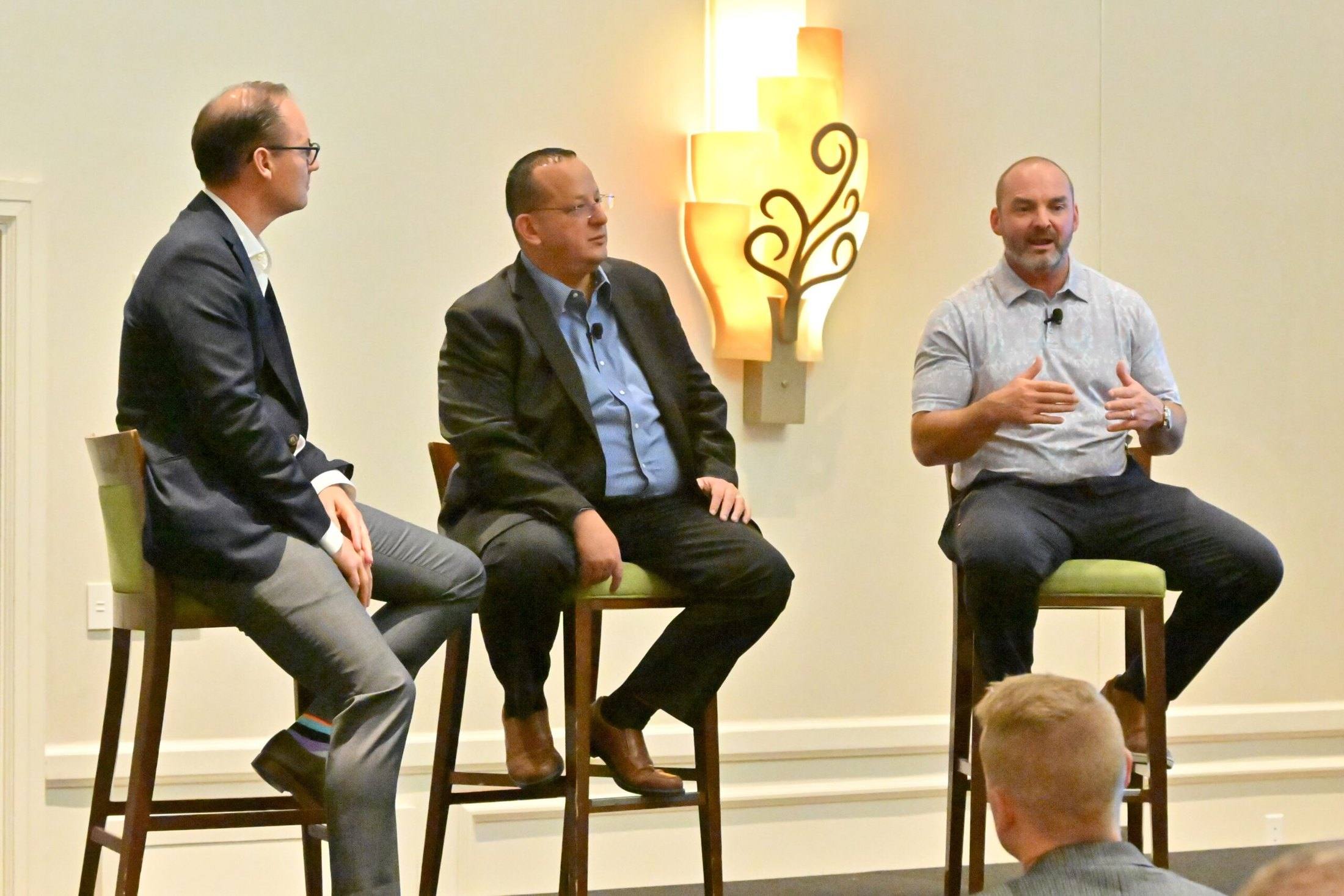 Travis Woods on a three-person panel discussion at an XChange event